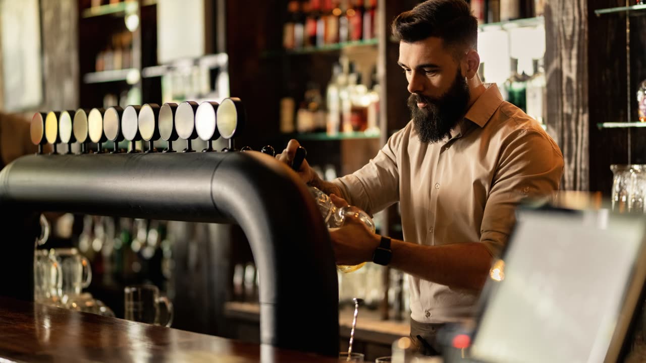 Bartender serving a guest at the bar, representing the hotel and food and beverage outlets that Shiji Daylight PMS and Shiji Infrasys POS run, connected to payments through Juno.